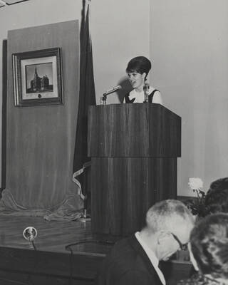 1964 photograph of 75th Anniversary. A speaker at a podium during the 75th Anniversary.
