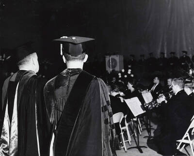 1964 photograph of 75th Anniversary. Symphonic Band performing in academic regalia during the 75th anniversary Convocation.