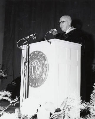 1964 photograph of 75th Anniversary. President D.R. Theophilus giving a speech from a lectern.