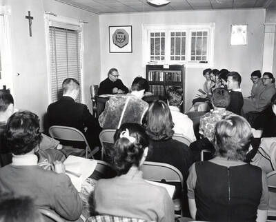 1950 photograph of Religious Education. Students studying during class. Donor: Publications Dept.