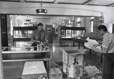 1966 photograph of Museum. Ellis Burcaw setting up displays.