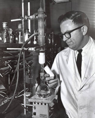 1968 photograph of Bacteriology. Duane LeTorneau operating experimental equipment.