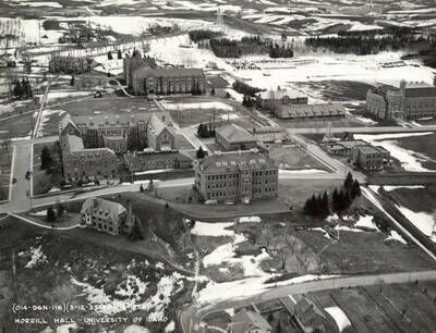 1950 photograph of University of Idaho campus. Aerial view shows Morrill Hall in the center. Donor: Publications Dept.