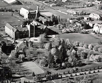 1950 photograph of University of Idaho campus. Aerial view shows tennis courts in lower left. Donor: Publications Dept.