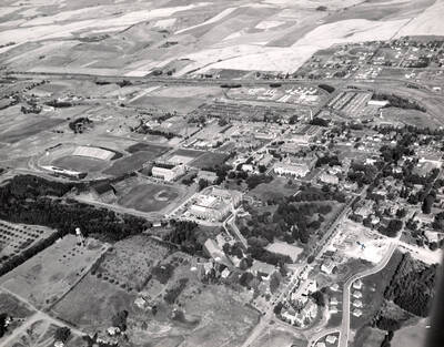 1951 photograph of University of Idaho campus. Aerial view shows both Neale Stadium and the baseball diamond.