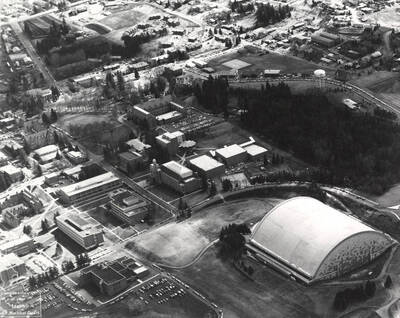 1976 photograph of University of Idaho campus. Aerial view shows Kibbie Dome. Donor: Joe Ulliman.