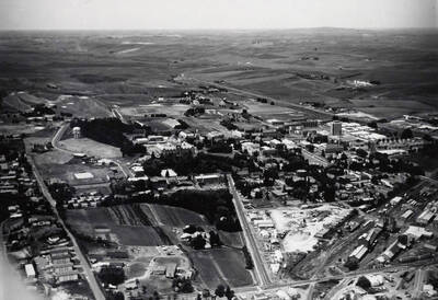 1974 photograph of University of Idaho campus. Aerial view shows campus and fields.