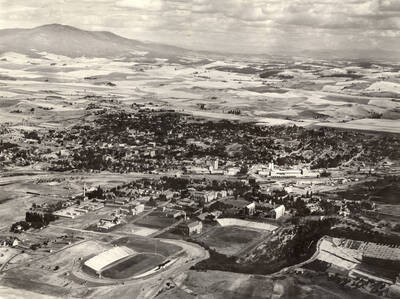 1938 photograph of University of Idaho campus. Aerial view shows both campus and Moscow.
