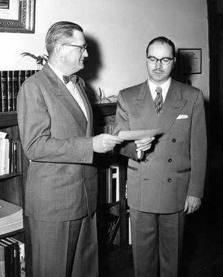 1953 photograph of Gifts. President J. E. Buchanan and Hall Macklin with the check from the Jewetts for pipe organ.