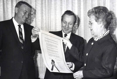 1969 photograph of Gifts. l-r: Donald Seelye, Earl Bullock, and Mrs. Elbert S. Rawls. Donor: Publications Dept.