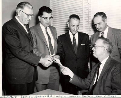 1958 photograph of Gifts. l-r: A.S. Gilbert, Donald L. Jordin, R.J. Wooley, James W. Martin, and James E. Kraus. Donor: Publications Dept.