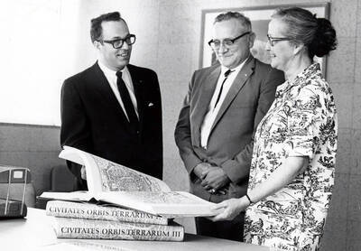 1967 photograph of Gifts. l-r: Richard Beck, Charles Webbert, and Nancy Atkinson. Donor: Publications Dept.