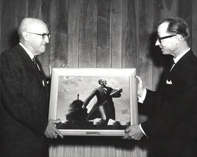 1962 photograph of Gifts. l-r: President Theophilus, G.H. Michalk. Donor: Publications Dept.