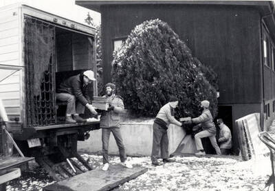 1983-11-23 photograph of Gifts. l-r: Paul Conditt, Marc Joop, Stan Shepard, Keith Petersen, and Richard Beck. Donor: Potlatch Corporation, Lewiston.
