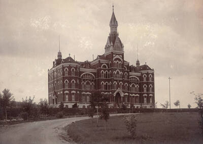 1905 photograph of Administration Building. View of the drive up to the old Administration and lawn. Donor: Charles E. Harris.