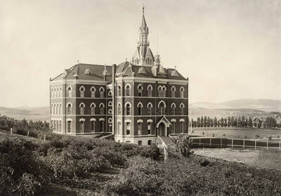 1905 photograph of Administration Building. View of the old administration Building and lawn.