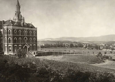 1902 photograph of Administration Building. View of the old administration and lawn with Moscow in the background.