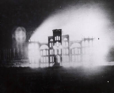 1906-03-31 photograph of Administration Building. View of the old Administration building on fire.