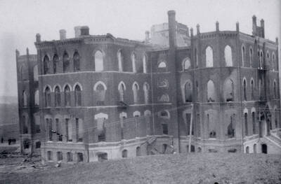 1906 photograph of Administration Building. View of the old Administration building after the fire. Donor: Claire Stevenson.