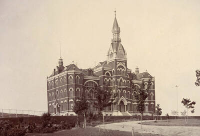 1898 photograph of Administration Building. View of the old Administration and lawn.