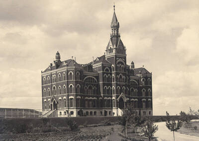 1900 photograph of Administration Building. View of the old Administration and lawn.