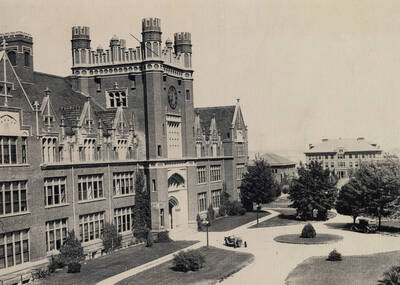 1921 photograph of Administration Building. View of automobiles out front.