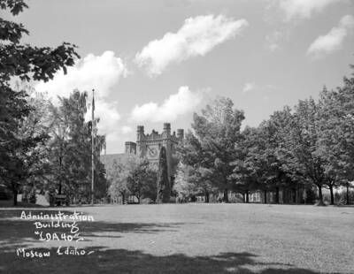 1948 photograph of Administration Building. View of the lawn, with cannon on the left.