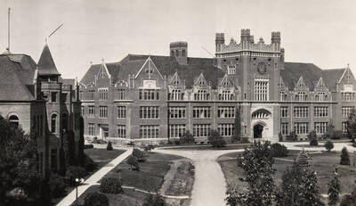 1922 photograph of Administration Building. View of the drive in front of the Administration with the Engineering building to the left.