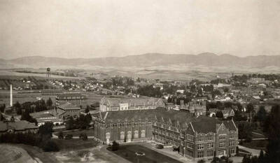 1934 photograph of Administration Building Stough Archives. View of the clock tower between the trees