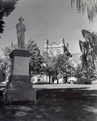 1941 photograph of Administration Building hand tinted. View of Spanish-American War Memorial statue.