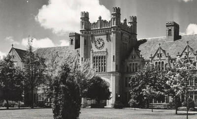 1924 photograph of Administration Building. View of clock tower and lawns.