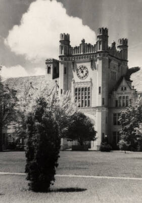 1926 photograph of Administration Building. View of clock tower and lawns.