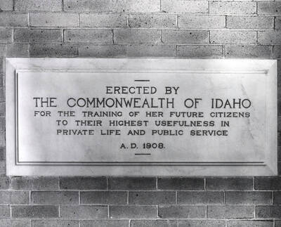 1961 photograph of Administration Building. A close up of the 1908 Dedicatory plaque.