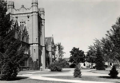 1951 photograph of Administration Building. View of students walking to class .