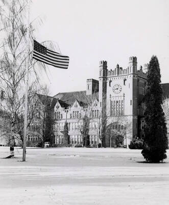 1940 photograph of Administration Building. Flag hung at half mast.