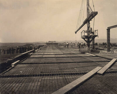 1908 photograph of Administration building construction. Morrill Hall may be seen in the distance. Donor: Marie Skog.