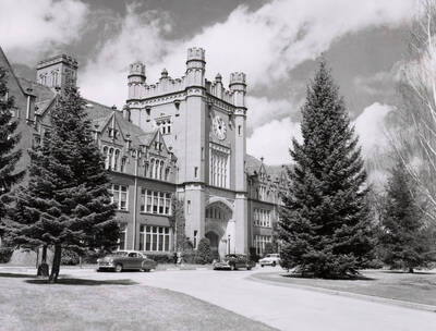 1944 photograph of Administration Building. View of the drive with automobiles.