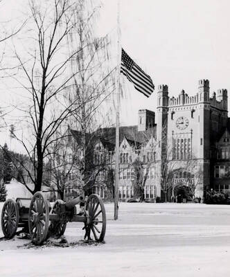 1949 photograph of Administration Building. View of University of Idaho Cannons on lawn.