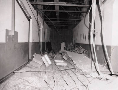 1969-04-01 photograph of Administration Building. View of third floor corridor after ceiling collapse.