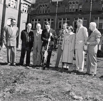 1950-03-31 photograph of Administration Building Office Building (Annex) l-r: Harry Dewey, Fred Skog, Jay G. Eldridge, J.L. McCarthy, Robert Moulton, Janice McCormick, J.E. Buchanan, T.S. Kerr.