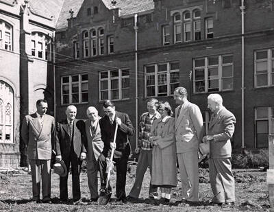 1950-03-29 photograph of Administration Building Office Building (Annex) l-r: Harry Dewey, Fred Skog, Jay G. Eldridge, J.L. McCarthy, Robert Moulton, Janice McCormick, J.E. Buchanan, T.S. Kerr.
