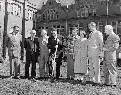 1950-03-30 photograph of Administration Building Office Building (Annex) l-r: Harry Dewey, Fred Skog, Jay G. Eldridge, J.L. McCarthy, Robert Moulton, Janice McCormick, J.E. Buchanan, T.S. Kerr.