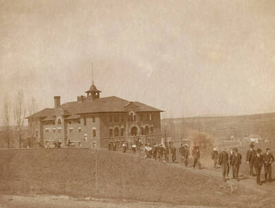 1906-03-31 photograph of Gymnasium. View of students walking to class.
