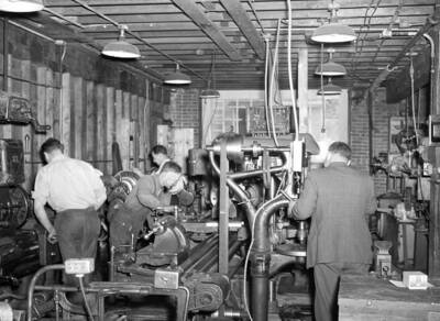 1950 photograph of Engineering Building. View of students in lab.