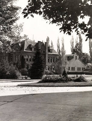 1933 photograph of Engineering Building. View of the Administration drive and fountain.