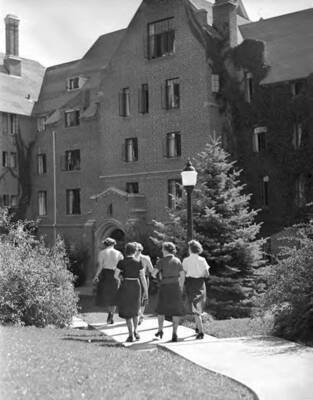 1941 photograph of Hays Hall. Women walking back to their dormitory.