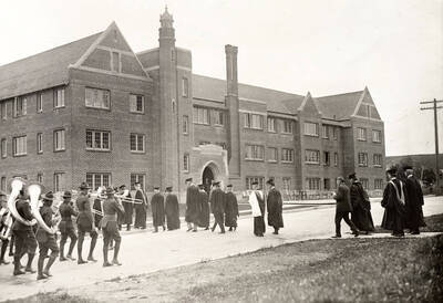 1923-06-11 photograph of Forney Hall. View of military band on the way to the dedication.