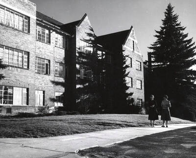 1940 photograph of Forney Hall. View of students walking to class. Donor: Publications Dept.