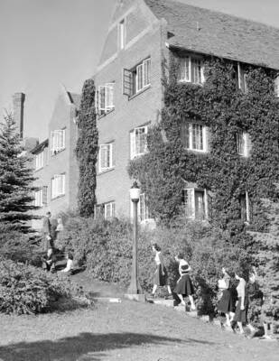 1945 photograph of Forney Hall. View of students walking to class.