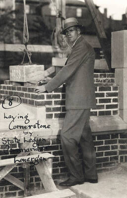 1928 photograph of Memorial Gymnasium. State Legion Commander Lonergan lays the cornerstone.